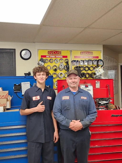 Gage Peterson and another working in shop